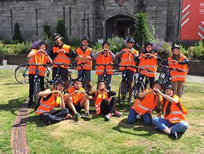 group of people in high vis jackets with bikes 